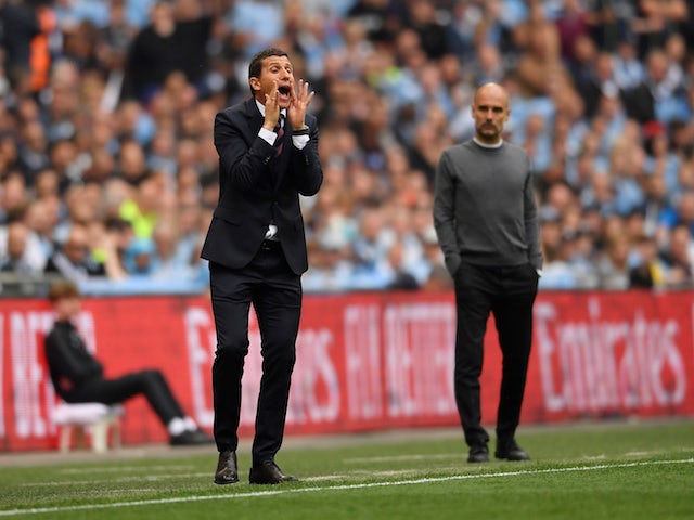 Watford manager Javi Gracia reacts as Manchester City manager Pep Guardiola looks on on May 18, 2019