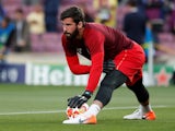 Alisson Becker warms up on May 1, 2019