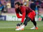 Alisson Becker warms up on May 1, 2019