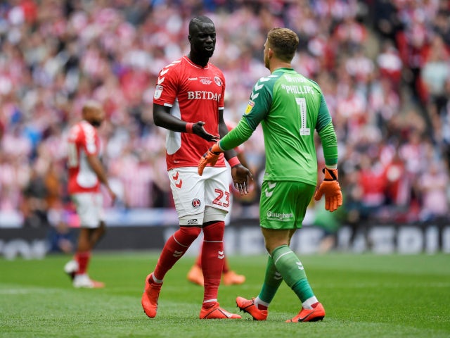 Charlton Athletic's Mahamadou-Naby Sarr talks with Dillon Phillips following the calamitous own goal against Sunderland in the League One playoff final on May 26, 2019