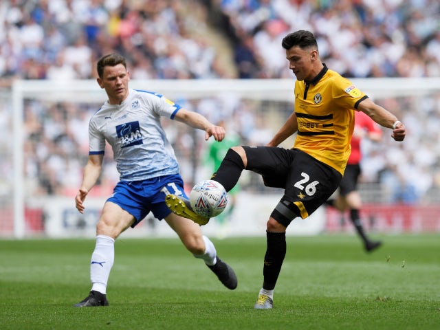 Newport County's Regan Poole in action with Tranmere Rovers' Connor Jennings in the League Two playoff final on May 25, 2019