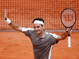 Roger Federer celebrates winning his first round match against Italy's Lorenzo Sonego at the French Open on May 26, 2019