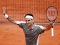 Roger Federer celebrates winning his first round match against Italy's Lorenzo Sonego at the French Open on May 26, 2019