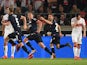 Union Berlin's Marvin Friedrich celebrates scoring their second goal with team mates as VfB Stuttgart's Gonzalo Castro looks dejected on May 23, 2019