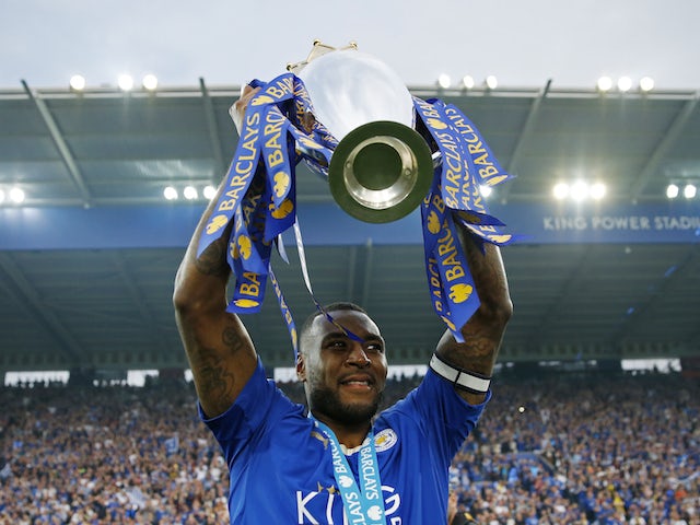 Leicester City's Wes Morgan lifts the Premier League trophy in May 2016