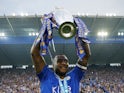 Leicester City's Wes Morgan lifts the Premier League trophy in May 2016
