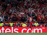 Divock Origi celebrates after scoring Liverpool's second goal in the Champions League final win over Tottenham Hotspur on June 1, 2019