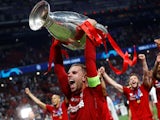 Liverpool captain Jordan Henderson lifts the Champions League trophy on June 1, 2019