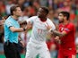 Switzerland's Denis Zakaria and Portugal's Ruben Neves argue with the referee in the UEFA Nations League on June 5, 2019.