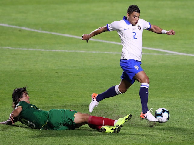 Brazil's Thiago Silva in action with Bolivia's Marcelo Martins in the Copa America on June 14, 2019