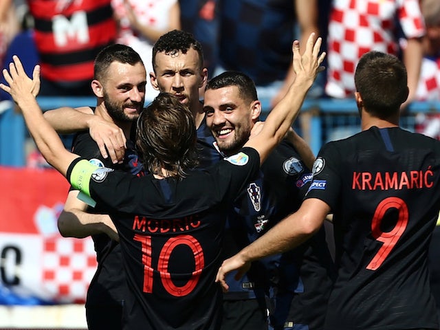 Croatia's Ivan Perisic celebrates scoring their second goal against Wales with Luka Modric and team mates on June 8, 2019