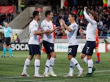 France's Florian Thauvin celebrates scoring their third goal with with team mates on June 11, 2019