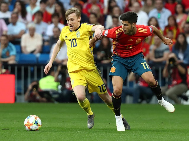 Spain's Marco Asensio in action with Sweden's Emil Forsberg in their Euro 2020 qualifier on June 10, 2019