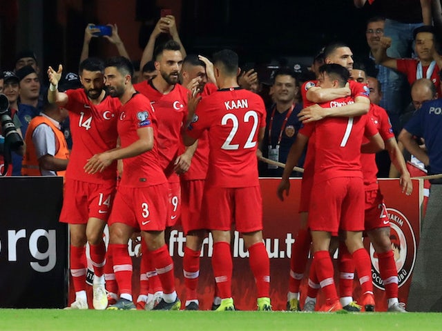Turkey's Cengiz Under celebrates scoring their second goal against France with teammates on June 8, 2019