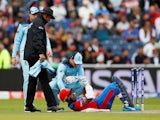 Afghanistan's Hashmatullah Shahidi is floored by a bouncer against England on June 18, 2019