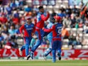 Afghanistan's Mujeeb Ur Rahman celebrates taking the wicket of India's Rohit Sharma on June 22, 2019