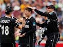 New Zealand's Lockie Ferguson celebrates with team mates after taking the wicket of South Africa's Faf du Plessis
