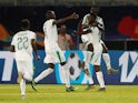 Senegal's Krepin Diatta celebrates scoring their second goal against Tanzania with Ismaila Sarr and team mates on June 23, 2019