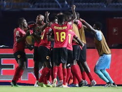 Angola's Djalma celebrates scoring their first goal with teammates against Tunisia on June 24, 2019