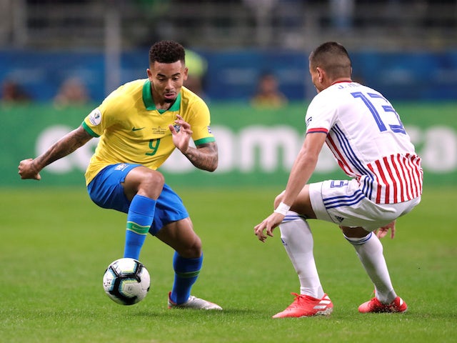 Brazil's Gabriel Jesus in action with Paraguay's Junior Alonso in the quarter-finals of the Copa America on June 27, 2019