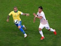 Brazil's Dani Alves in action with Paraguay's Santiago Arzamendia in the quarter-finals of the Copa America on June 27, 2019