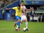Brazil's Roberto Firmino in action with Paraguay's Fabian Balbuena in the quarter-finals of the Copa America on June 27, 2019