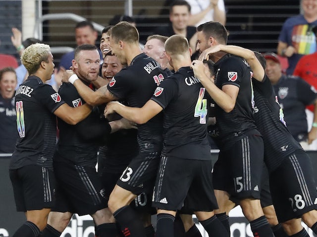 Wayne Rooney scores from inside his own half as DC United beat Orlando