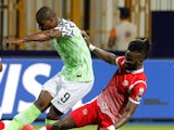 Burundi's Gael Bigirimana challenges Nigeria's Odion Ighalo at the 2019 Africa Cup of Nations