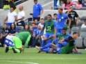 Curacao defender Jurien Gaari celebrates with teammates after scoring a goal in stoppage time against Jamaica at the Gold Cup on June 26, 2019
