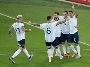 Giovani Lo Celso is congratulated by his Argentina teammates after scoring his side's second goal against Venezuela on June 28, 2019