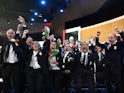 Delegation members representing Milan Cortina celebrate after the city won the bid to host the 2026 Winter Olympic Games during the 134th Session of the International Olympic Committee (IOC), at the SwissTech Convention Centre, in Lausanne, Switzerland Ju