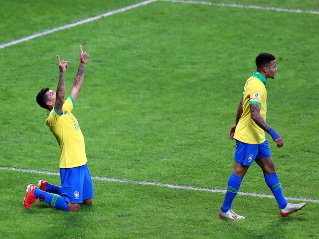 Brazil's Roberto Firmino celebrates scoring their second goal with Gabriel Jesus on July 3, 2019