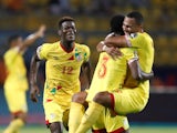 Benin's Khaled Adenon, David Kiki and Olivier Verdon celebrate after the match against Cameroon on July 2, 2019
