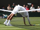 Nick Kyrgios larking about during his Wimbledon first-round match on July 2, 2019