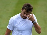 Switzerland's Stan Wawrinka reacts during his second round match against Reilly Opelka on July 3, 2019