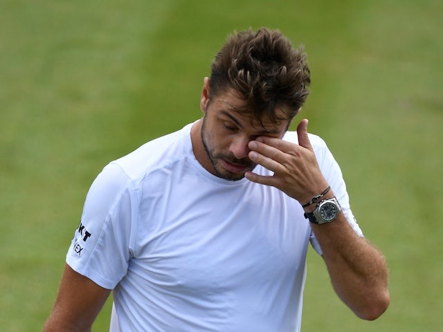 Switzerland's Stan Wawrinka reacts during his second round match against Reilly Opelka on July 3, 2019