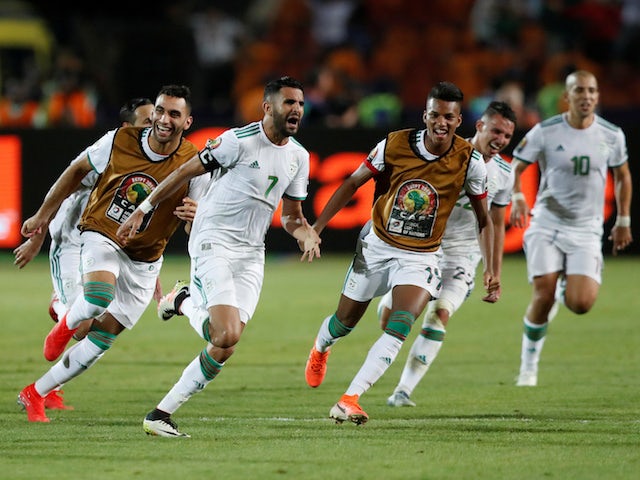 Algeria's Riyad Mahrez celebrates scoring their second goal against Nigeria with teammates on July 14, 2019