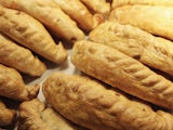 A collection of undoubtedly-delicious pasties, probably Cornish, possibly cheese and onion