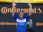 Deceuninck-Quick Step rider Elia Viviani of Italy celebrates winning the stage on the podium on July 9, 2019