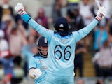 England's Eoin Morgan and Joe Root celebrate after the match against Australia on July 11, 2019