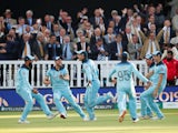 England's Jos Buttler celebrates winning the world cup with team mates after running out New Zealand's Martin Guptill on July 14, 2019