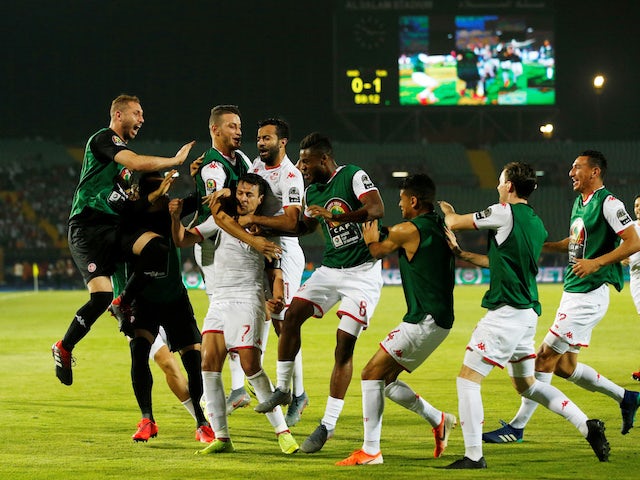 Tunisia's Youssef Msakni celebrates scoring their second goal with team mates on June 11, 2019