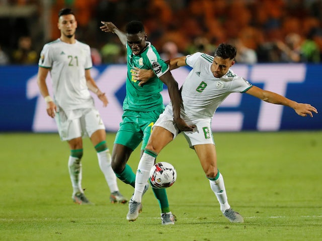 Algeria's Youcef Belaili in action with Senegal's Ismaila Sarr in the Africa Cup of Nations final on July 19, 2019