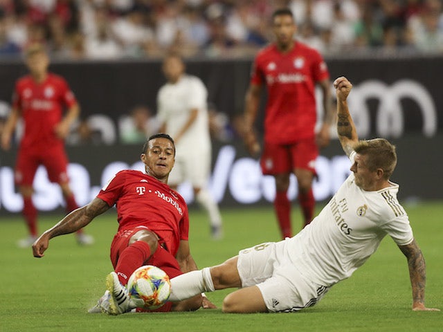 Real Madrid's Toni Kroos in action with Bayern Munich's Thiago in the International Champions Cup on July 20, 2019