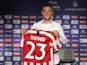 Atletico Madrid's new signing Kieran Trippier poses with a shirt during the unveiling on July 18, 2019