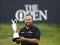 Shane Lowry celebrates with the Claret Jug after winning The Open Championship golf tournament during the final round at Royal Portrush Golf Club on July 21, 2019