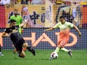 Ruben Neves and Ian Carlo Poveda-Ocampo fight for the ball as Wolverhampton Wanderers face Manchester City in the Premier League Asia Trophy.
