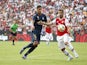 Arsenal's Henrikh Mkhitaryan in action with Real Madrid's Raphael Varane in the International Champions Cup on July 23, 2019