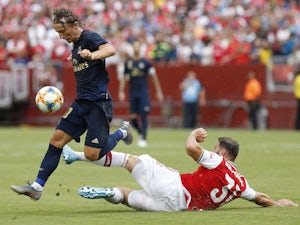 Arsenal's Sead Kolasinac in action with Real Madrid's Luka Modric in the International Champions Cup on July 23, 2019