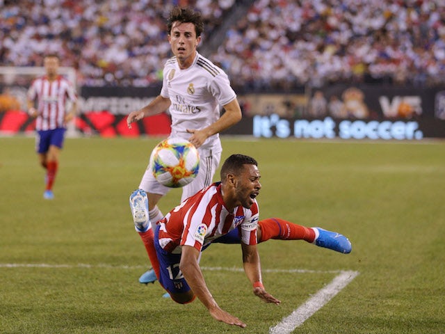 Real Madrid's Alvaro Odriozola in action with Atletico Madrid's Renan Lodi in the International Champions Cup on July 26, 2019